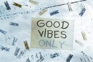 Conceptual hand writing showing Good Vibes Only. Concept meaning Just positive emotions feelings No negative energies Colored clothespin rectangle shaped paper blue background