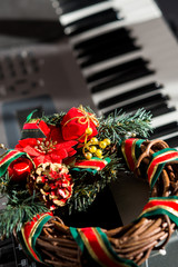 Colorful christmas decorations attached to an elecric guitar.