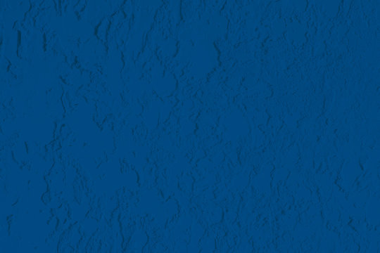 Classic blue texture plaster texture. Texture surface of the wall. Classic blue decorative background in grunge style. Copyspace