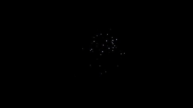 Explosion of bright colorful part of fireworks on black background to create a set salute on video for holiday new year, birthday, wedding or other celebration.