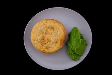 Beef pie with mushy peas