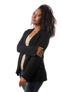 Portrait Of Afro Hairstyle Black Woman Looking Confident At Camera With Serious Expression. Standing Against White Background.