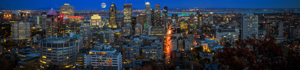 Amazing view of Montreal city at sunset with colorful neon light building.