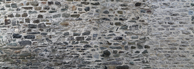 Stone wall texture. Gray stone wall background.