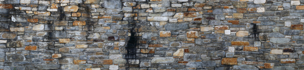 Stone wall texture background panorama, natural color.
