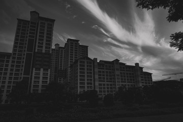 cloud streaks with residential buildings in the foreground