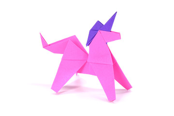 Unicorn. Pink unicorn origami paper art isolated on white background. Ideas for DIY hobby (Do It Yourself) for Children.                                