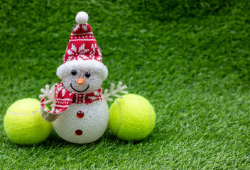 Tennis Christmas Holiday with Santa Claus on green grass with tennis ball