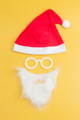 A hat, glasses and beard make up Santa Claus