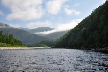 Travelling along the taiga river in Russian Far East