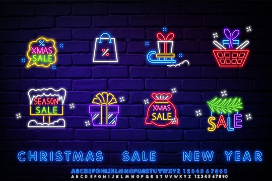 Neon christmas sale icons set. Neon sign with snowflakes light banner design element colorful modern design trend, night bright advertising, bright sign. Vector illustration