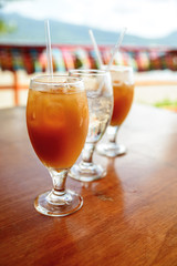 Three wineglasses with cold juice and water