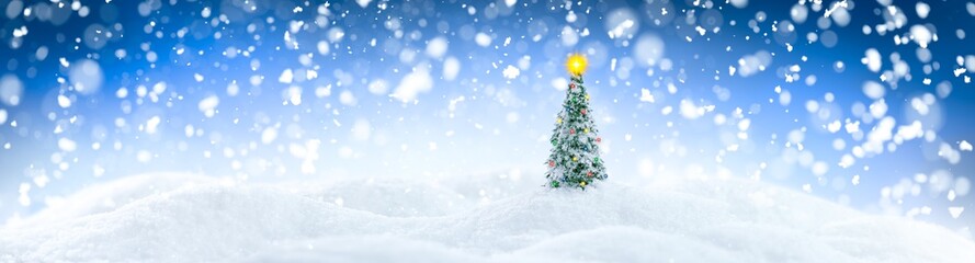 Naklejka na ściany i meble Wintery landscape background with single Christmas tree on glistening white snow drifts surrounded by snowfall