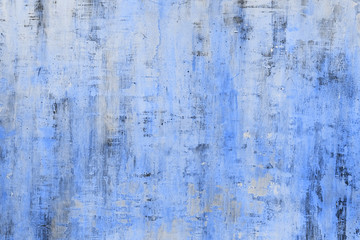Traditional classic moroccan blue color background in Chefchaouen. Clay old wall texture. Painted...