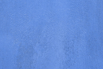 Traditional classic moroccan blue color background in Chefchaouen. Clay wall texture. Painted...