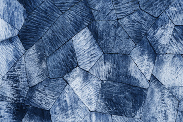 Blue tiled stone wall background, pattern with different geometric shapes.