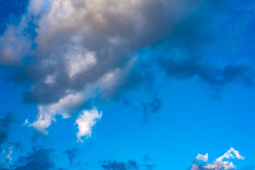 Blue sky with white clouds. Blue sky with black clouds.