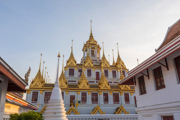Fototapeta premium Loha Prasat, The metallic castle covered with gold leaf of Wat Ratchanadda Temple in Bangkok, Thailand.