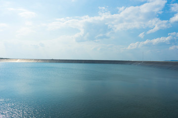 Reservoir and wind turbine at Lam Ta Kong Dam, Nakhon Ratchasima, Thailand.