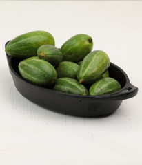 Parval or Pointed gourd in a wooden contianer.