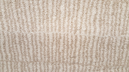 close up fiber of brown fabric roll selection / fashion design business, raw material in garment manufacturing