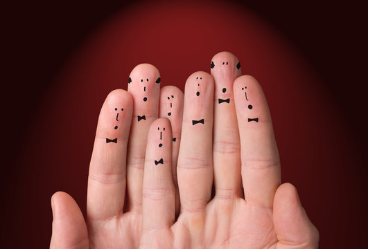 Faces are painted on the fingers. Choir singing together. Cheerful fingers depict a classic choir