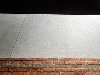 Cement finished and brick exposed wall