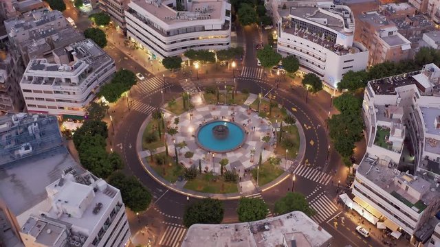 Dizengoff square in tel Aviv, Israel, at night, 4k aerial drone view