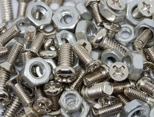 close up marco pile of old metal nuts and bolts on white isolate background - 308376771