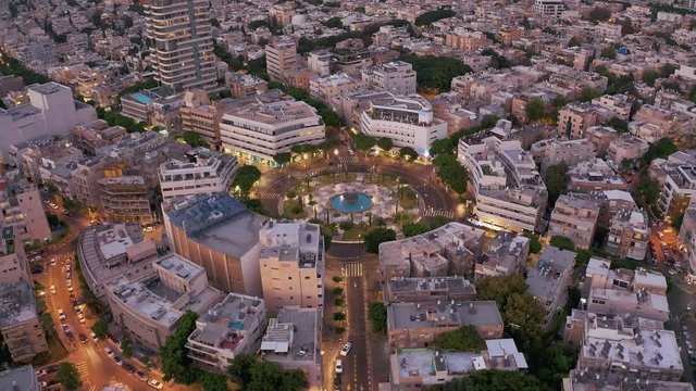 Dizengoff square in tel Aviv, Israel, at night, 4k aerial drone view