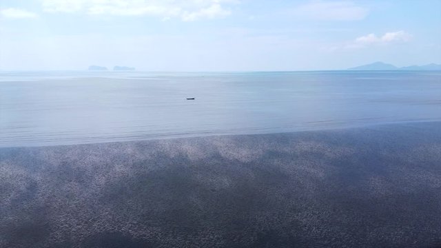 Aerial Shot Revolving boat on the beach from Thailand