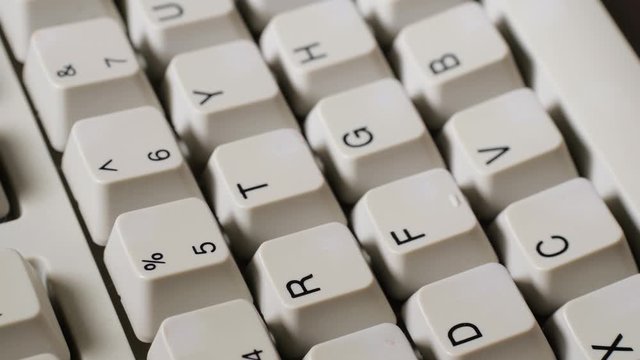 Finger presses nomber 5 or % button on keyboard