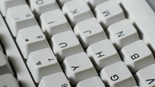 Finger presses nomber 7 or & button on keyboard