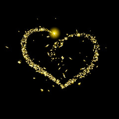 Gold pieces of foil fly in the shape of a heart