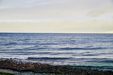 Norway landscape with beach of the Northern sea in cloudy weather