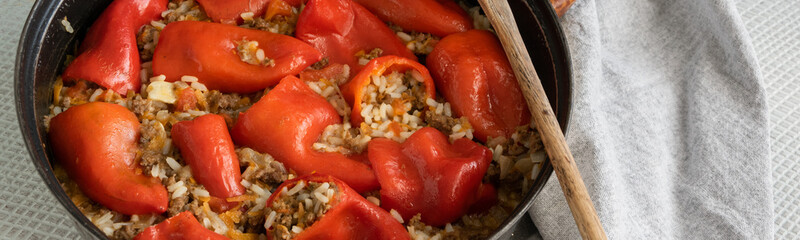 Ready for eat stuffed red peppers with minced meat, rice and vegetables