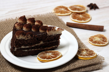 Slice Tiramisu Cake on a white plate.