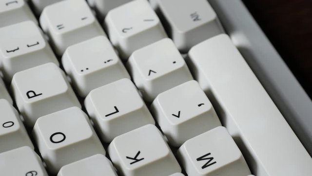 Finger presses comma or < button on keyboard