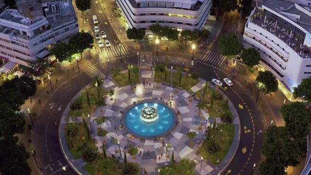 Dizengoff square in tel Aviv, Israel, at night, 4k aerial drone view