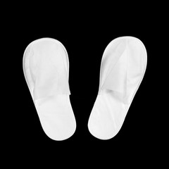 White house slippers. Isolated on black background. Close up