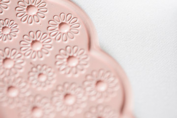 Pink themed festive wedding table setting and decoration with pink flowers, napkins, glasses and candles, vintage cutlery, resulting in a bright summer table decor