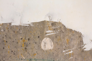 the process of updating gray concrete walls with putty