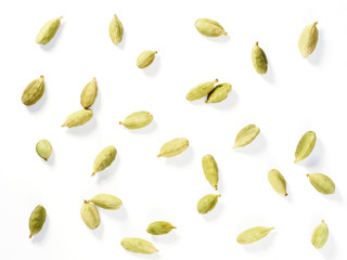 Spice Green Cardamom (Elettaria cardamomum) makes food tastier and healthier. Indian culinary ingredient. Grains isolated on white background