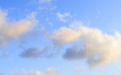 Puffy clouds against blue sky wallpaper background