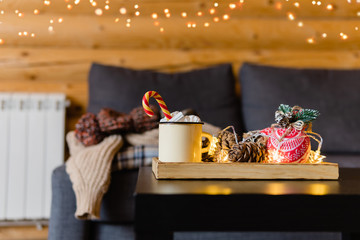 Cozy christmas concept. Still life details in in log cabin in winter.