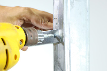 Self drilling screw driver drilling are installed on aluminum with steel equipment, isolated on white background.