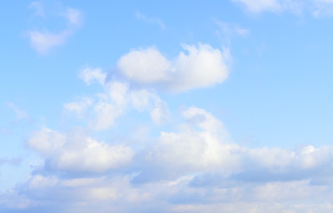 Puffy clouds against blue sky wallpaper background