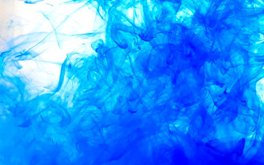 Blue fantastic abstract background. Watercolor ink in water. Cool trending screensaver.