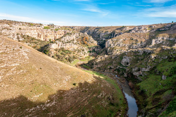 Obraz premium Matera, European Capital of Culture 2019, Italy. The city built on stones, created by sculpting rocks to obtain houses, existing since ancient times. Mountains of the city with rock caves.