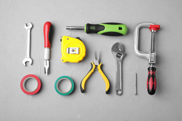 Flat lay composition with construction tools on light grey background